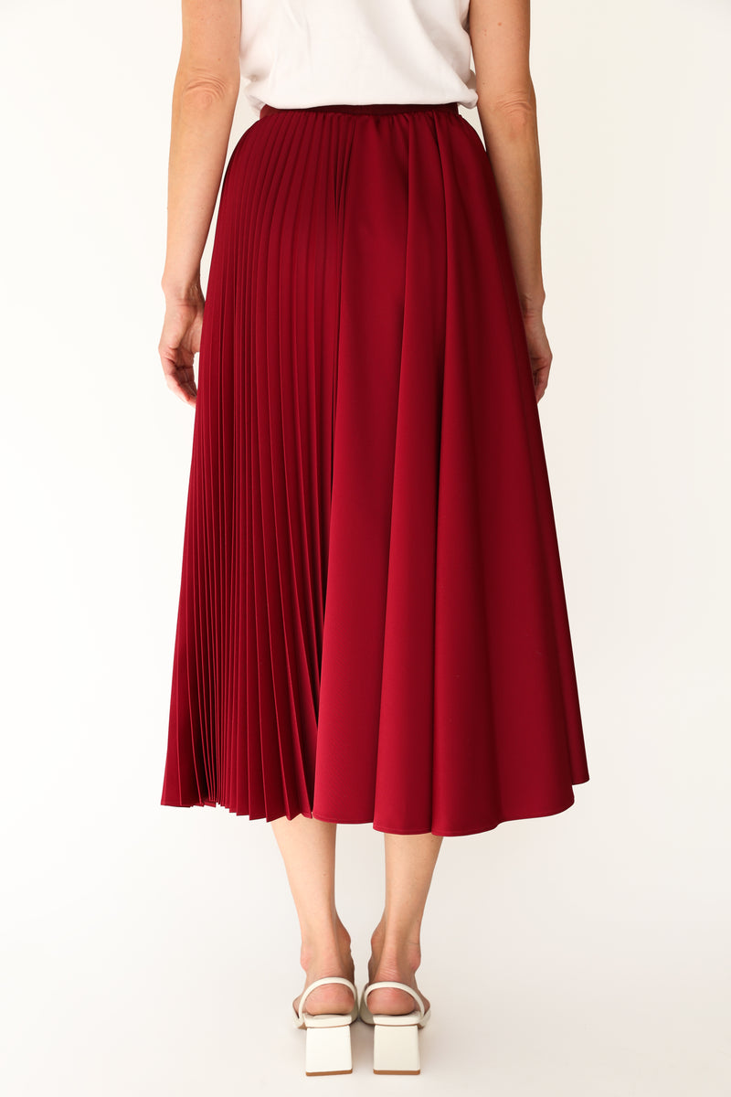 Kruhová poloplisovaná sukňa